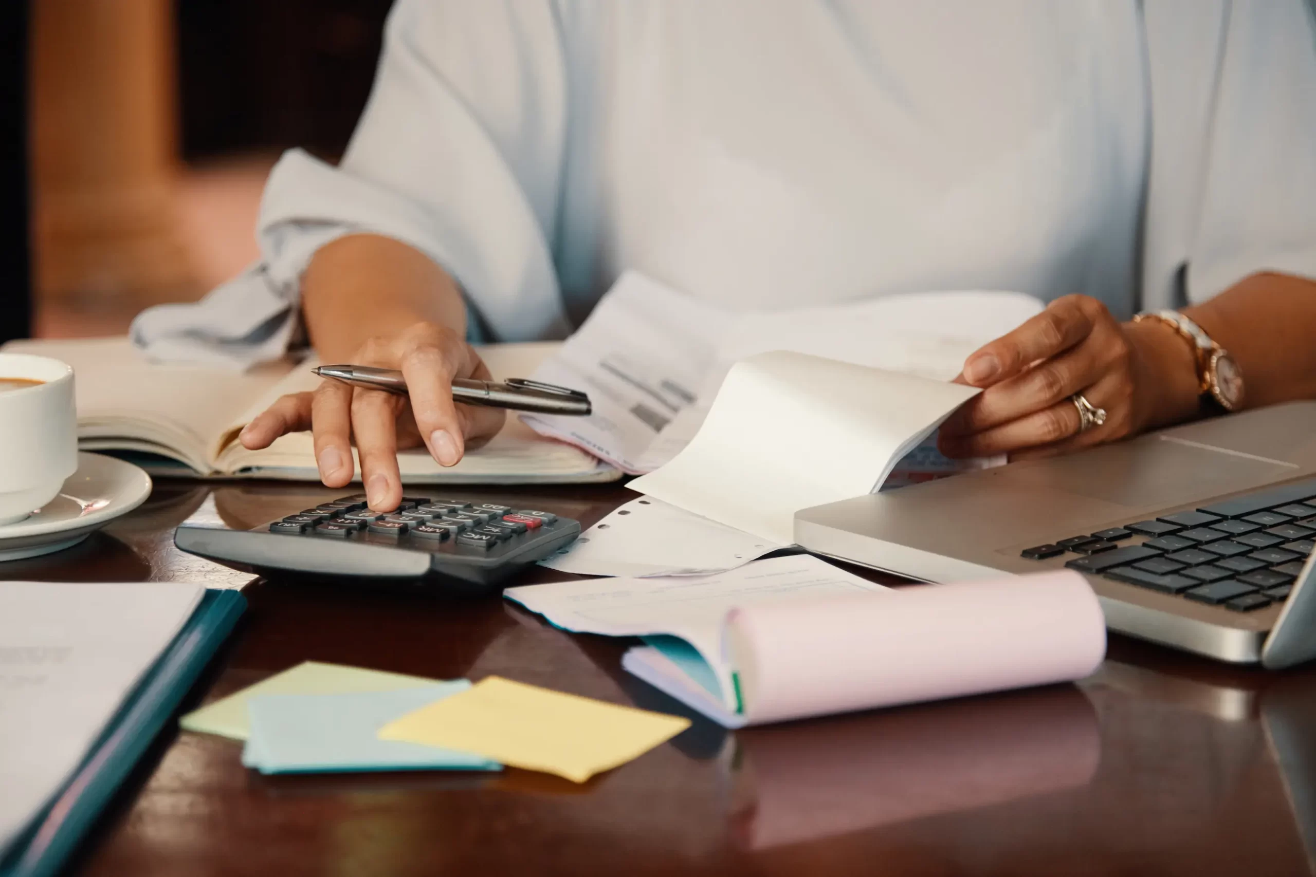 Entrepreneur Working With Bills Scaled 1